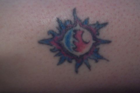 1987 Ford Bronco - A colorful tattoo is visible on skin, with a watermark at the bottom right.