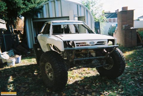 1991 Ford Bronco - This heavily modified truck features oversized tires and a custom front bumper, suggesting it's built for off-road use.