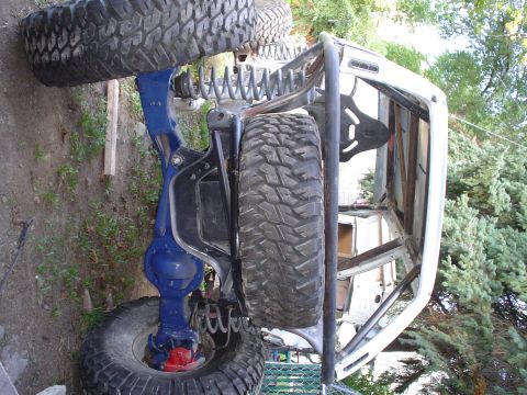 1981 Ford F-150 - This heavily modified truck chassis is shown from the side, with large off-road tires and a custom roll cage.