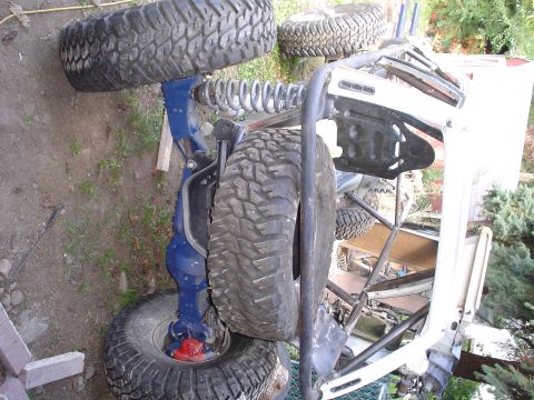 1981 Ford F-150 - Close-up view of the suspension and oversized tires on a custom off-road vehicle.