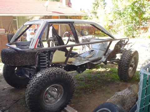 1981 Ford F-150 - This custom off-road buggy chassis is undergoing modifications in an outdoor setting.
