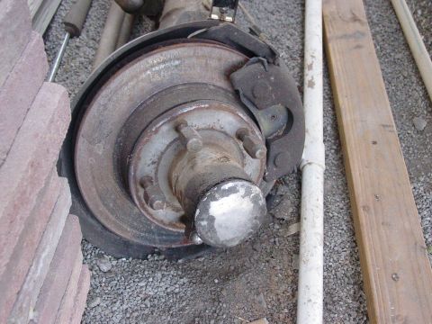 1979 Ford Bronco - Dana 44 front axle assembly, likely from a truck or SUV, shown with brake components.