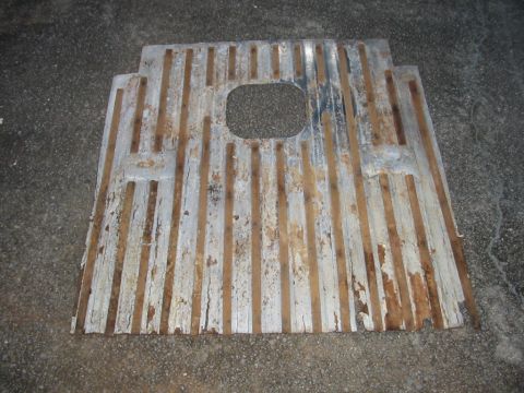 1988 Ford Bronco - Stock cardboard like material with wood sticks in grooves which was under the carpet. It was slightly rotted near the tailgate end.