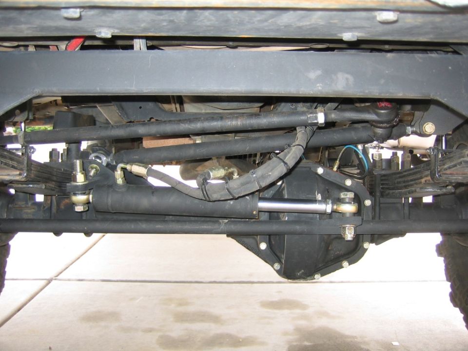 Close-up of Ford Bronco steering linkage and front axle components