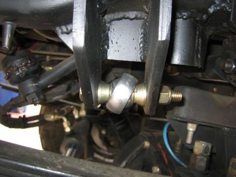 1994 Ford Bronco - This image shows a close-up view of a vehicle's steering and suspension system, focusing on a ball joint assembly.