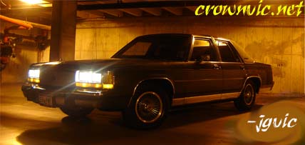 1988 Ford LTD Crown Victoria - A 1988 Ford Crown Victoria LTD is shown from a three-quarter front angle in an indoor setting.