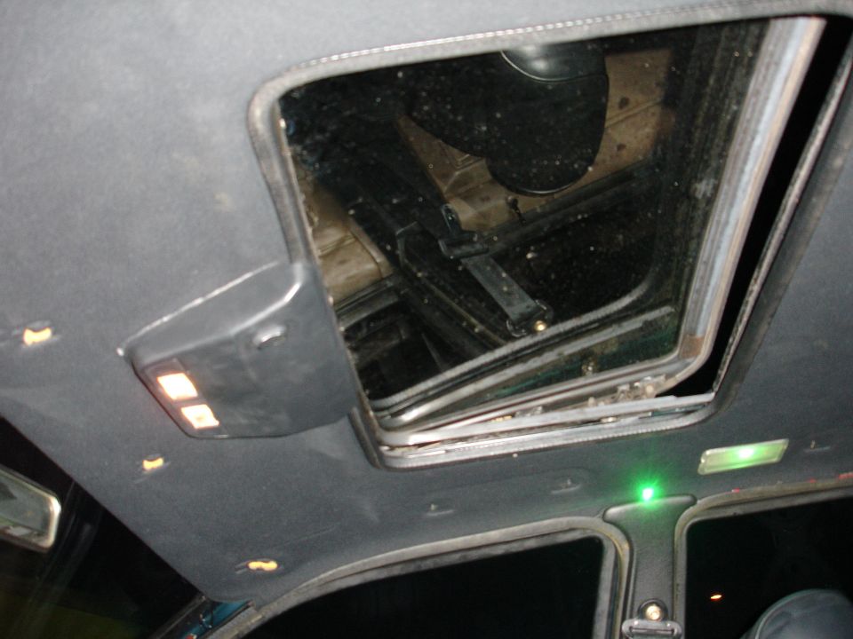 Interior sunroof mechanism and overhead lights