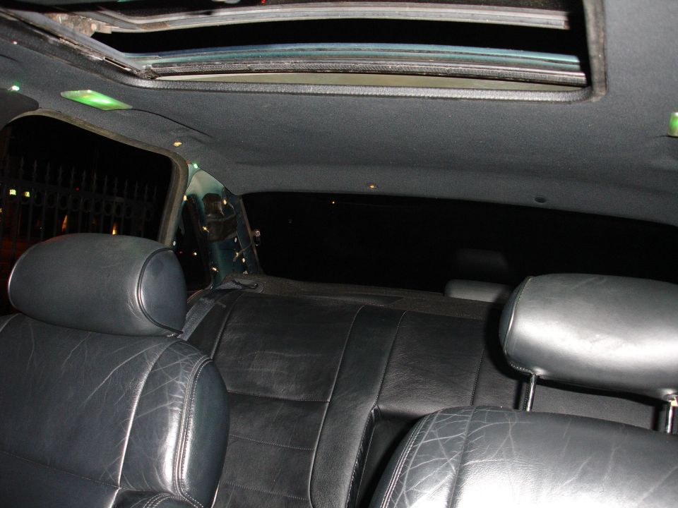 Black leather car seats and headliner with a sunroof