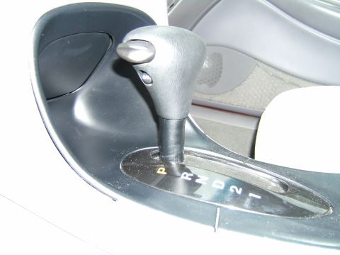 1998 Ford Taurus - The automatic transmission gear selector is visible with the indicator lights for park, reverse, neutral, drive, and lower gears.