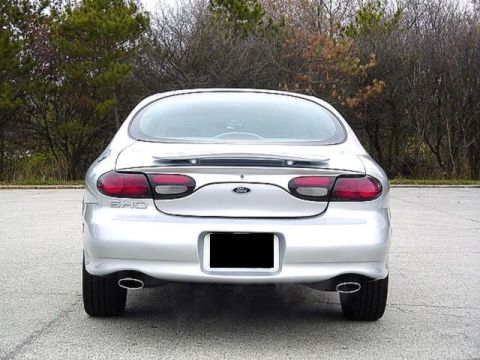 1998 Ford Taurus - Rear view of a silver 1998 Ford Taurus SHO sedan parked outdoors.