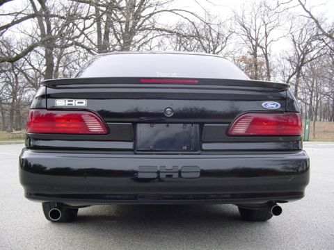 1998 Ford Taurus - The rear of a black Ford Taurus SHO shows its distinctive taillights and SHO badging.
