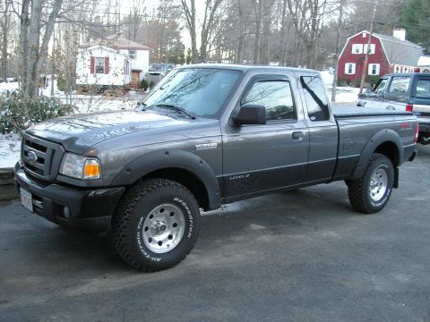 1994 Ford Bronco - This Ford Ranger pickup truck is parked in a residential area with snow on the ground.