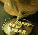 1986 Ford Bronco - Alphabet pasta spells out 'Happy New Year' on a reflective surface, possibly a mirror.