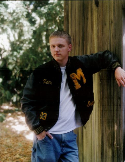 1996 Ford Probe - A young man poses for a photo, wearing a letterman jacket and jeans.