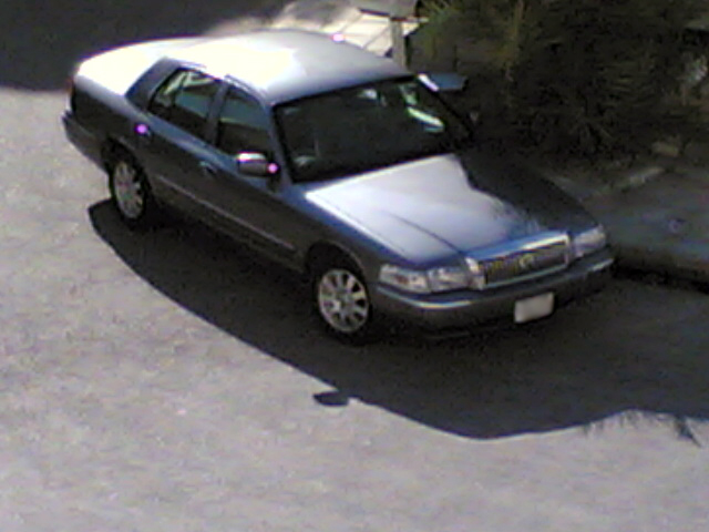 Blue 1999 Mercury Grand Marquis sedan, 3q front view