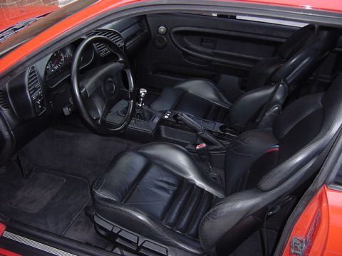 1995 BMW M3 - Interior of a 1995 BMW M3, black leather sport seats and a manual transmission.