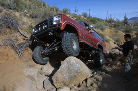 1994 Ford Bronco - This modified 1994 Ford Bronco navigates a rocky trail with assistance from a spotter.