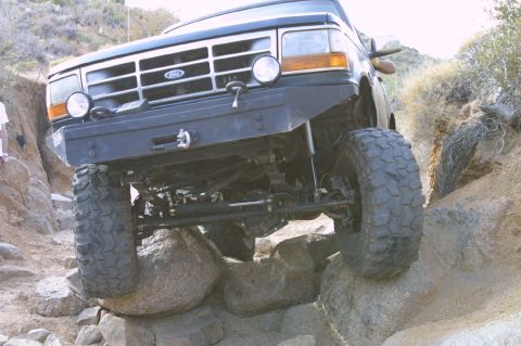 1994 Ford Bronco - This 1994 Ford Bronco is tackling a rocky off-road course with large tires and a lifted suspension.