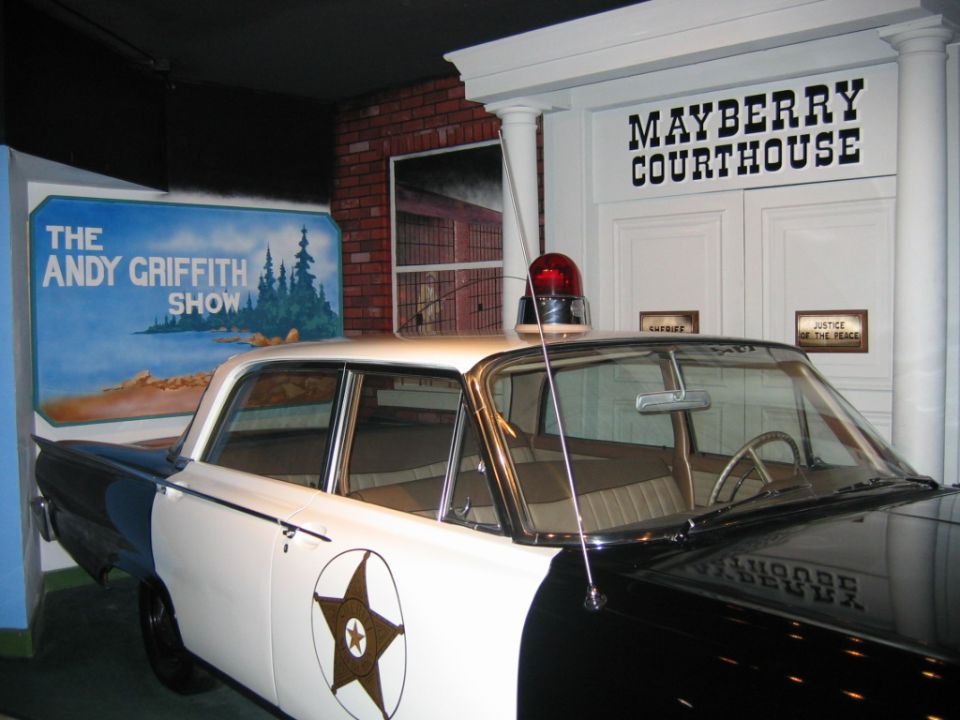 Police car in front of Mayberry Courthouse with Andy Griffith Show mural