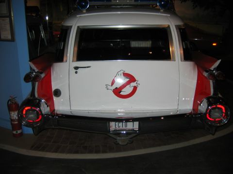 1985 Ford LTD Crown Victoria - The Ecto-1 movie car, famous from Ghostbusters, is seen from the rear.