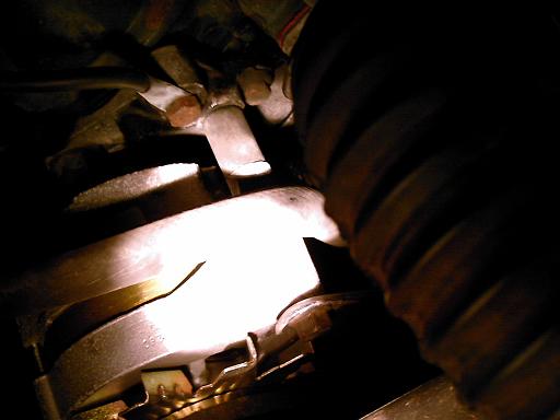 Close-up of a ribbed hose and metal engine component
