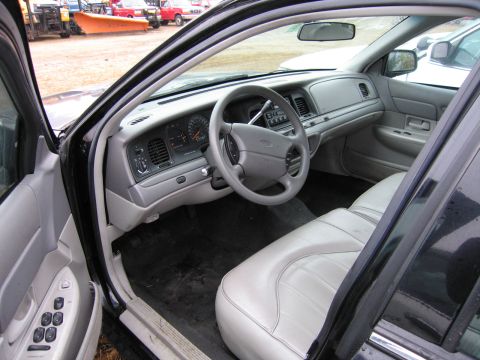 1991 Ford Crown Victoria LTD - Interior view of a car, showing the dashboard, steering wheel, and seats.
