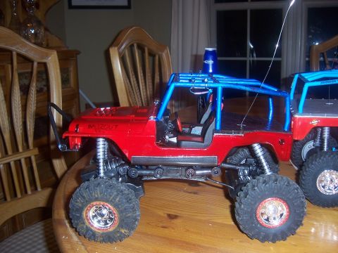 1999 Jeep TJ - comp cut, flat skid, rocker panels, 100 bbs, cut and reversed tires,battery moved to front, lengthend rear, rotated arms, and custom paint.