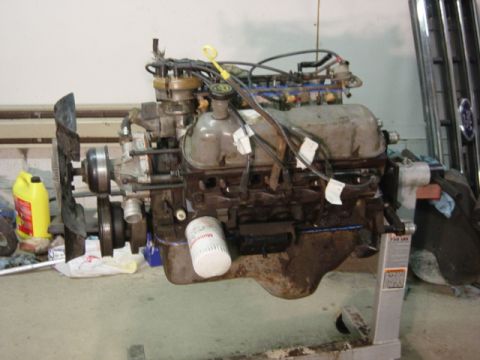 1991 Ford Bronco - Valve covers, plug wires, and ready to sit until it can go back in.
