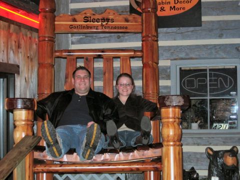 1985 Ford LTD Crown Victoria - A couple poses for a photo on an oversized rocking chair in Gatlinburg, Tennessee.