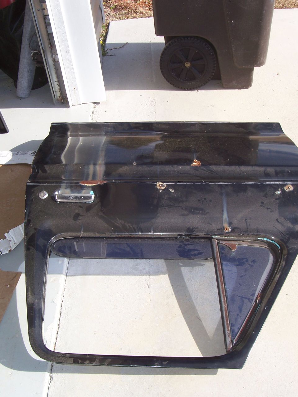 Got this intact door from a junkyard for $75. It was in much better shape than mine. It had slight surface and a few dents but the bottoms weren't rusted out.