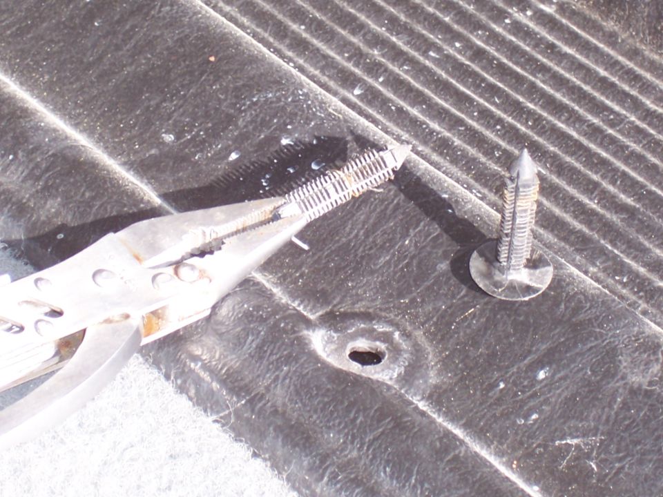 Remember this is an aftermarket panel. The stock panels don't have these types of fasteners but the concept is still the same. Pry, lift and pry and lift some more. Be gentle or you will break the panels, especially if they are the original style panels.