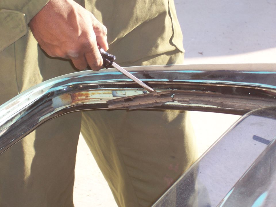 The window moulding on this truck was so brittle that it just fell apart in chunks.  Just use a flathead screwdriver and pry upwards.