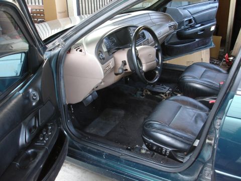 1993 Ford Taurus - Interior of a 1995 Ford Taurus, showing the dashboard, steering wheel, and seats.