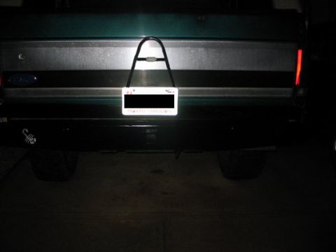 1996 Ford Bronco - Rear view of a 1996 Ford Bronco showing the bumper, license plate, and a scorpion decal on the left side.