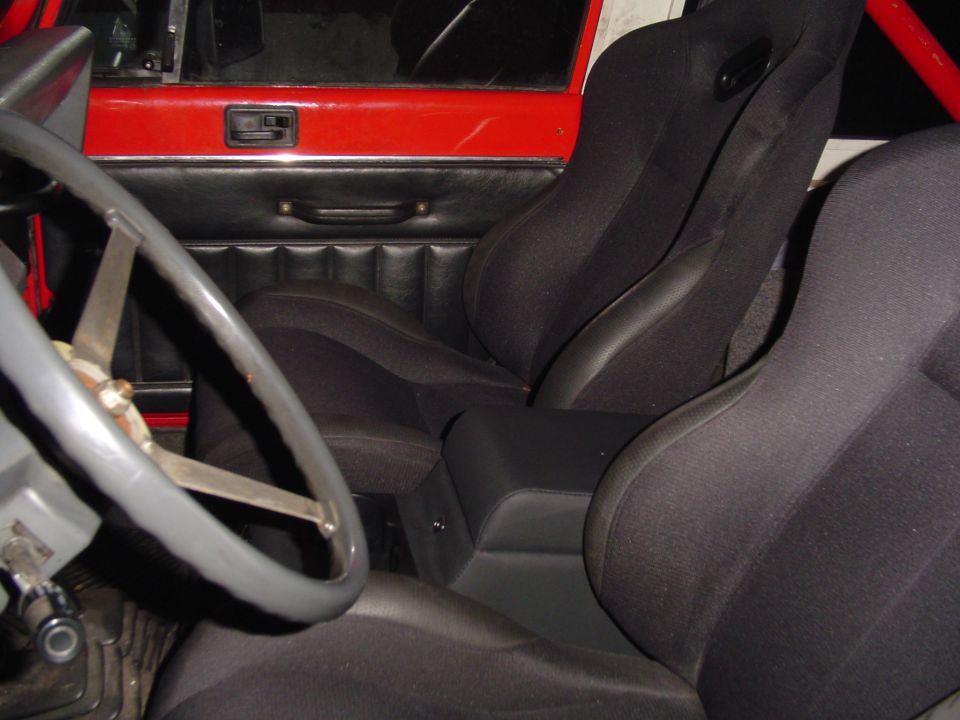 1989 Jeep YJ interior with racing seats and roll cage