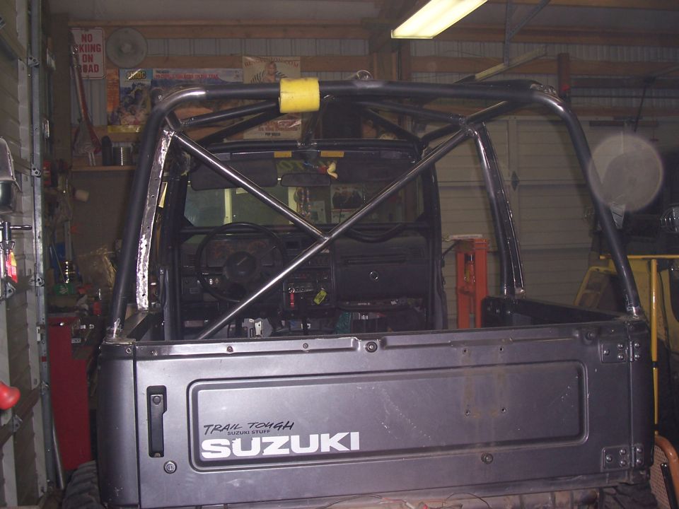 1988 Suzuki Samurai rear view with custom roll cage installed