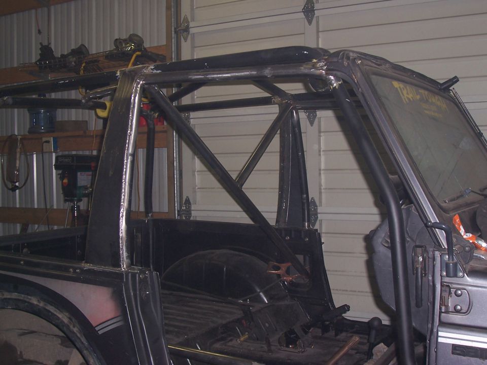 Side view of a vehicle with a custom roll cage installed