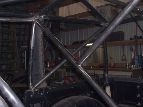 1988 Suzuki Samurai - Custom roll cage fabrication in progress, showing welded tubing and interior structure.