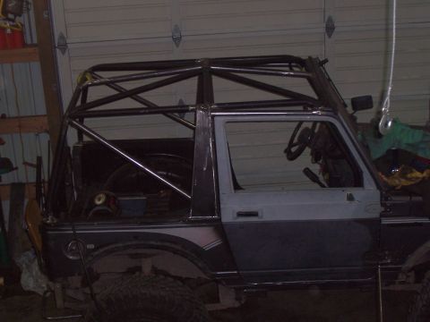 1988 Suzuki Samurai - Suzuki Samurai undergoing modification with a custom roll cage added.