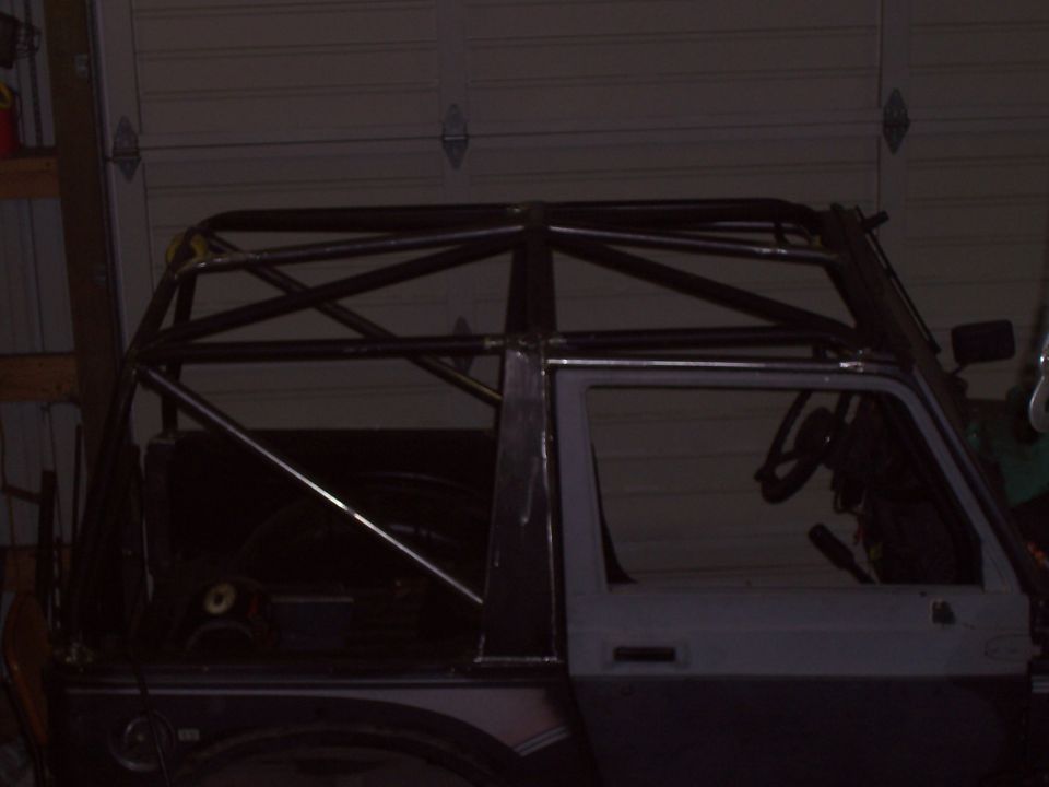 Side view of a vehicle with a custom roll cage installed