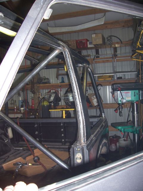 1988 Suzuki Samurai - Custom roll cage fabrication in progress inside a vehicle's interior.