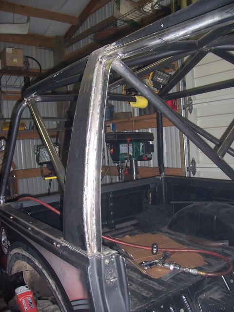 1988 Suzuki Samurai - Custom roll cage fabrication in progress inside a pickup truck bed.