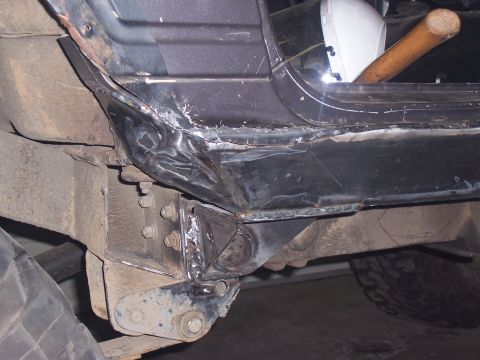 1988 Suzuki Samurai - Modified vehicle frame and body section, showing extensive welding and structural changes.
