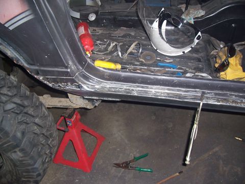 1988 Suzuki Samurai - Tools and safety equipment are laid out around the interior of a vehicle undergoing repairs.