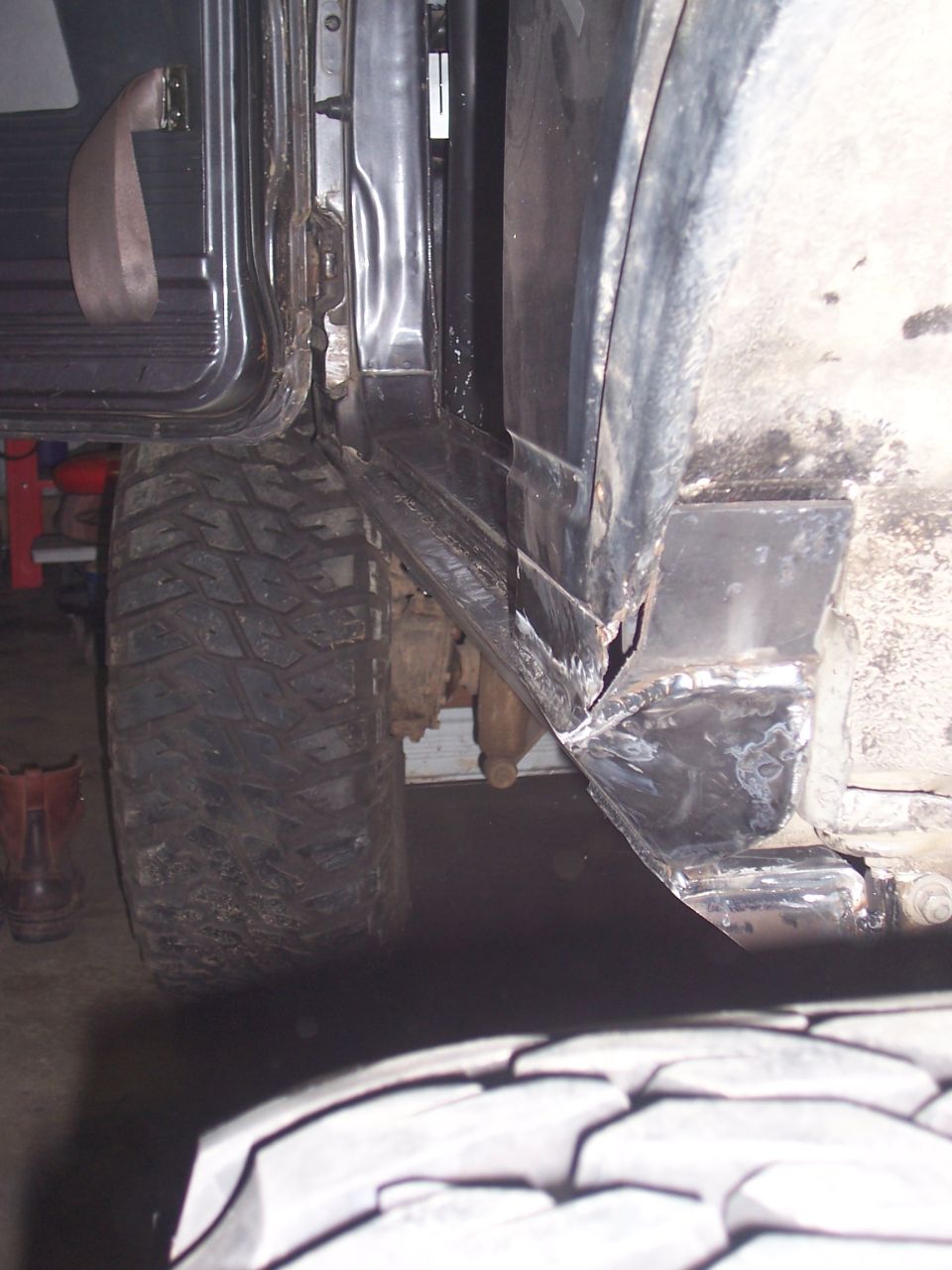 Modified rocker panel and large off-road tire