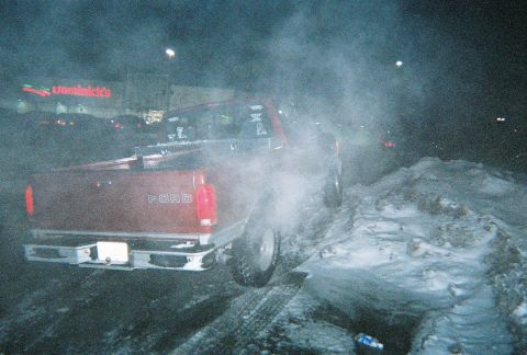 1996 Ford F-150 - A Ford F-150 is seen in a snowy environment, possibly at night, with steam emanating from the vehicle.