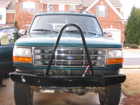 1996 Ford Bronco - This 1996 Ford Bronco features a custom front bumper and brush guard, with a prominent Ford grille.