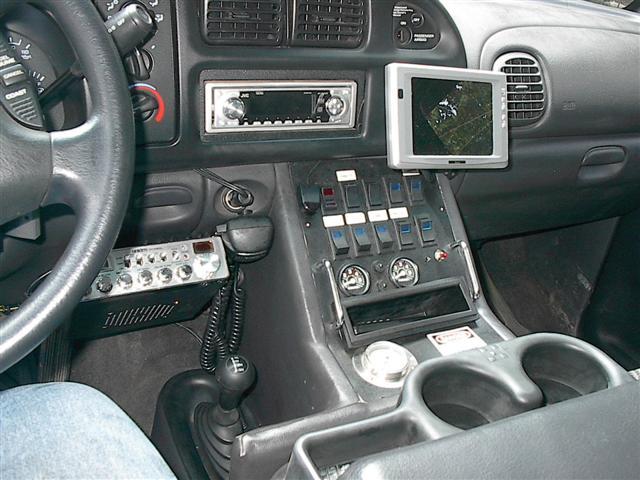 2001 Dodge 1500 interior showing dashboard, steering wheel, CB radio, and monitor