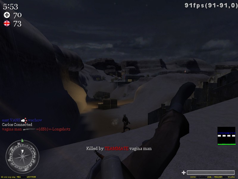 First-person view in a video game, showing a snowy landscape with buildings and a character running. Text indicates player stats and a kill notification