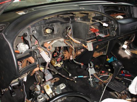 1993 Ford Taurus - Interior view of a 1993 Ford Taurus with the dashboard disassembled, revealing the wiring.